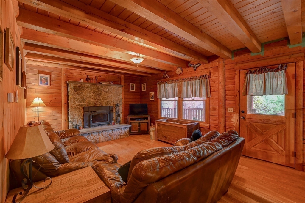 23 Dana Road Petersham, MA 01366 - Photo 6 of 32 a bed room with furniture and a fireplace