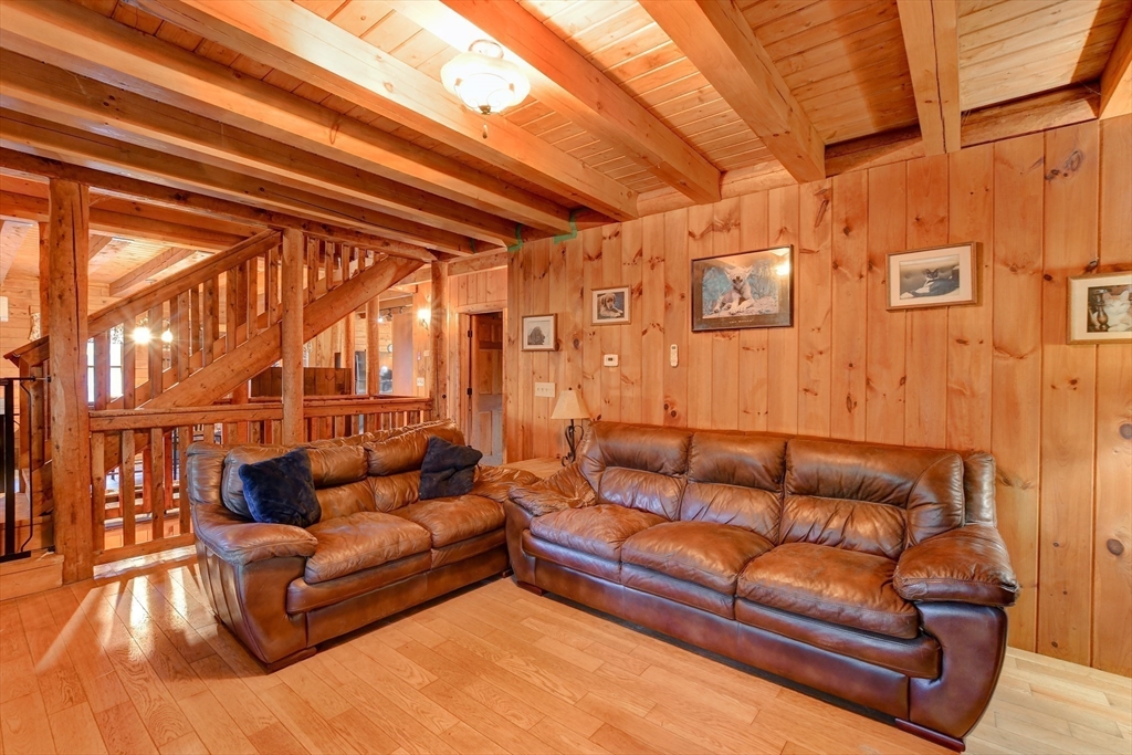23 Dana Road Petersham, MA 01366 - Photo 7 of 32 a living room with furniture and a rug