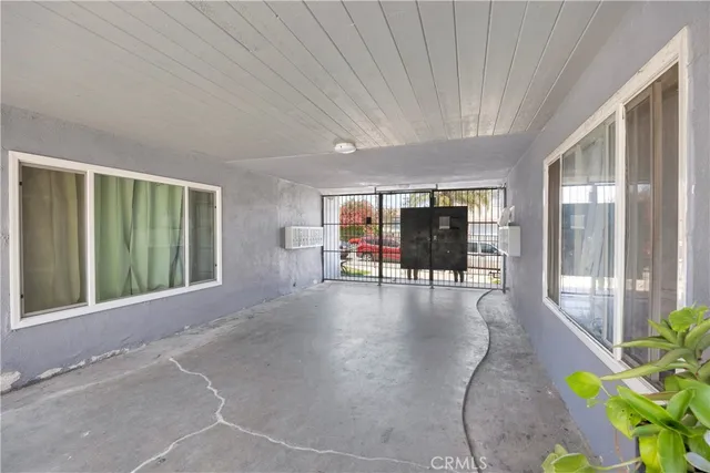 a lobby with furniture and floor to ceiling window