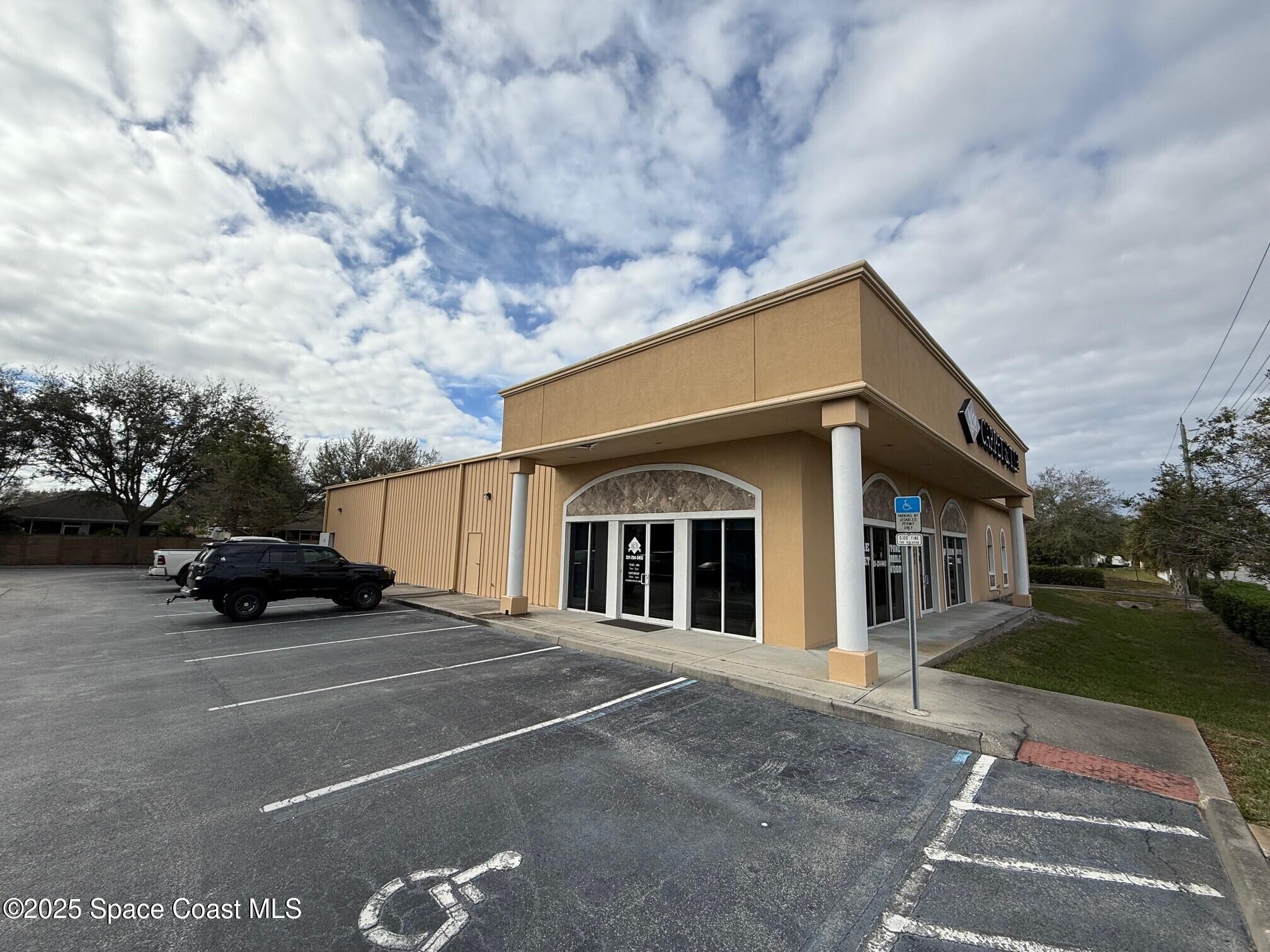 1301 Lake Washington Road Melbourne, FL 32935 - Photo 1 of 13 a view of a car park in front of house