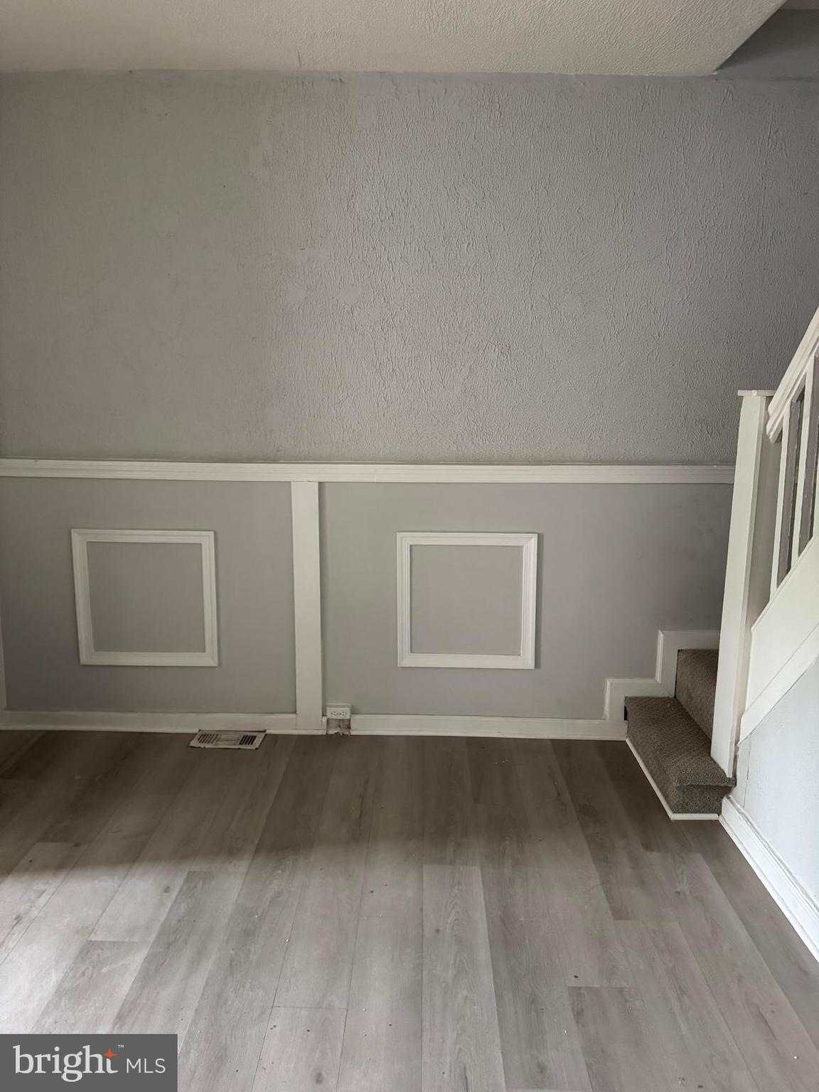 2240 Cedley Street Baltimore, MD 21230 - Photo 2 of 12 a view of a livingroom with wooden floor and a window
