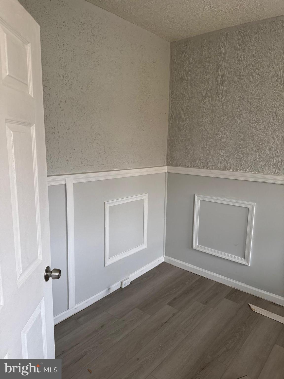 2240 Cedley Street Baltimore, MD 21230 - Photo 3 of 12 an empty room with wooden floor closet and windows