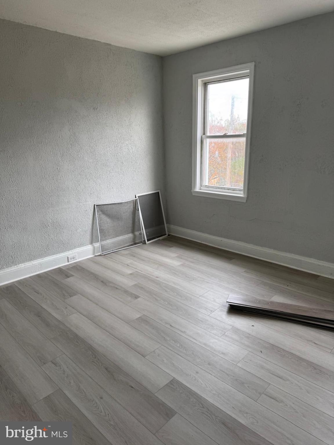 2240 Cedley Street Baltimore, MD 21230 - Photo 4 of 12 a view of wooden floor and windows in a room