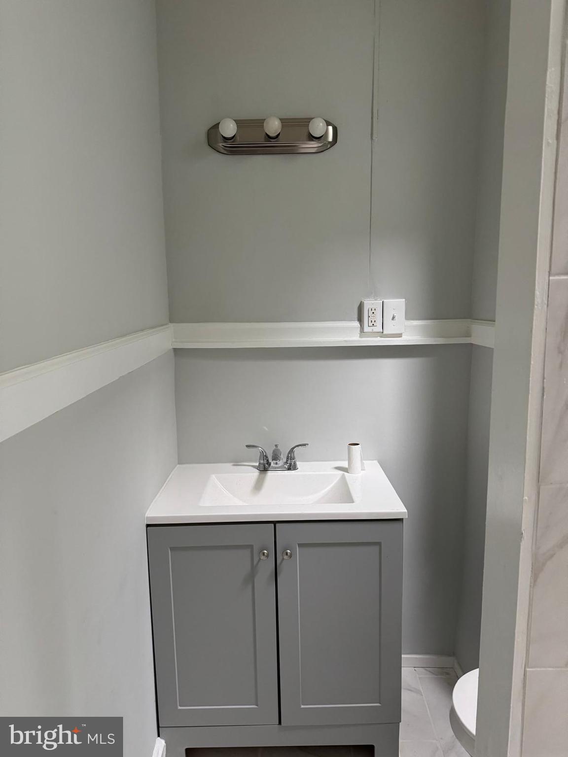 2240 Cedley Street Baltimore, MD 21230 - Photo 7 of 12 a bathroom with a sink and a toilet