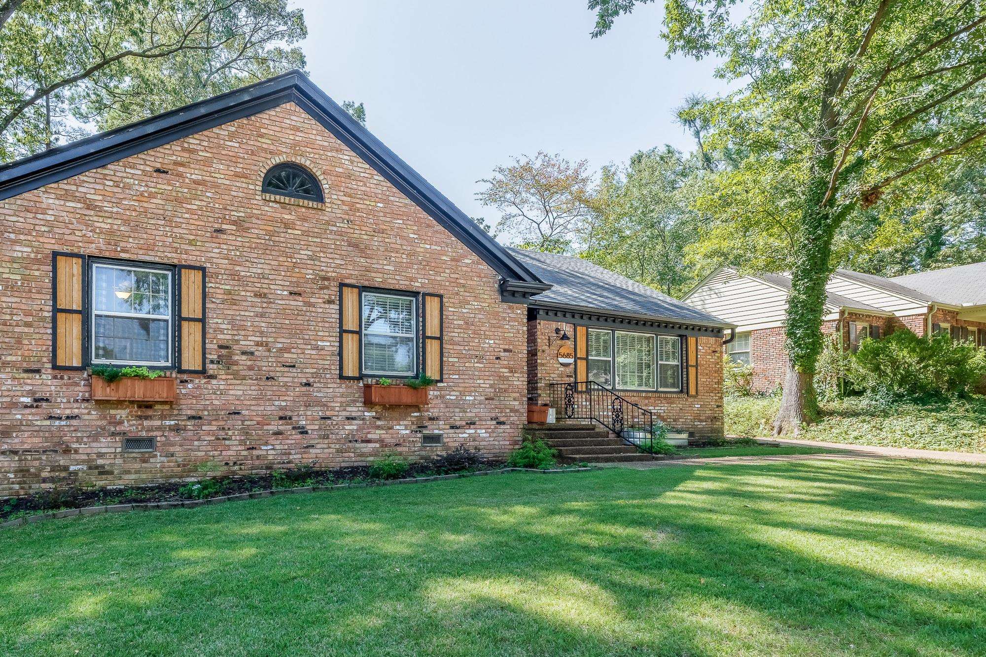 5685 Barfield Road Memphis, TN 38120 - Photo 2 of 25 a front view of house with yard and green space
