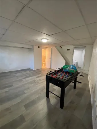 a room with furniture and a wooden floor