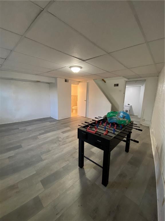 113 Kirkpatrick Street Pittsburgh, PA 15219 - Photo 12 of 29 a room with furniture and a wooden floor