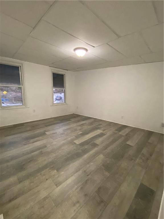 113 Kirkpatrick Street Pittsburgh, PA 15219 - Photo 17 of 29 an empty room with wooden floor and windows