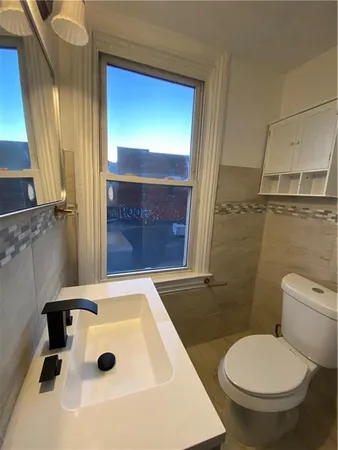 an empty room with a empty space and windows