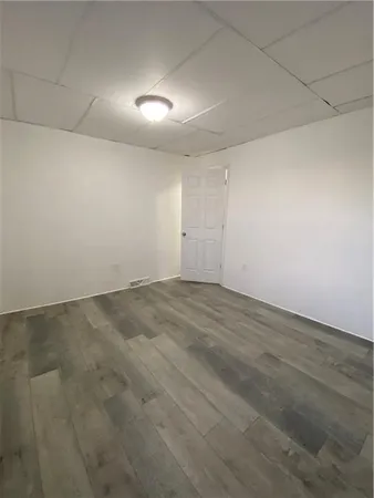 an empty room with a empty space and windows