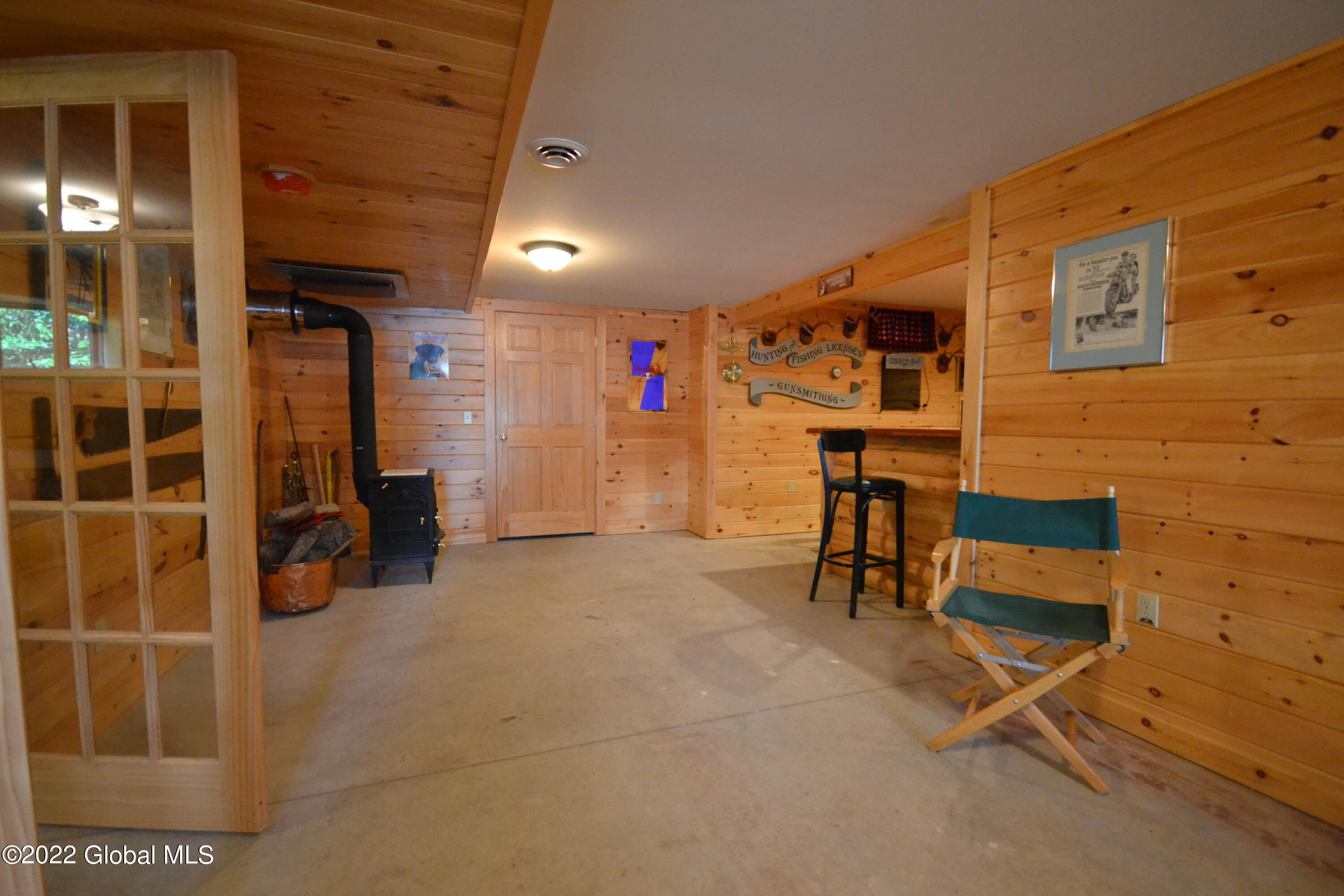 932 Goodnow Flow Road Newcomb, NY 12852 - Photo 18 of 21 Goodnow Bar room with Woodstove