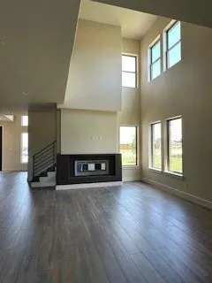 a view of a room with window and wooden floor