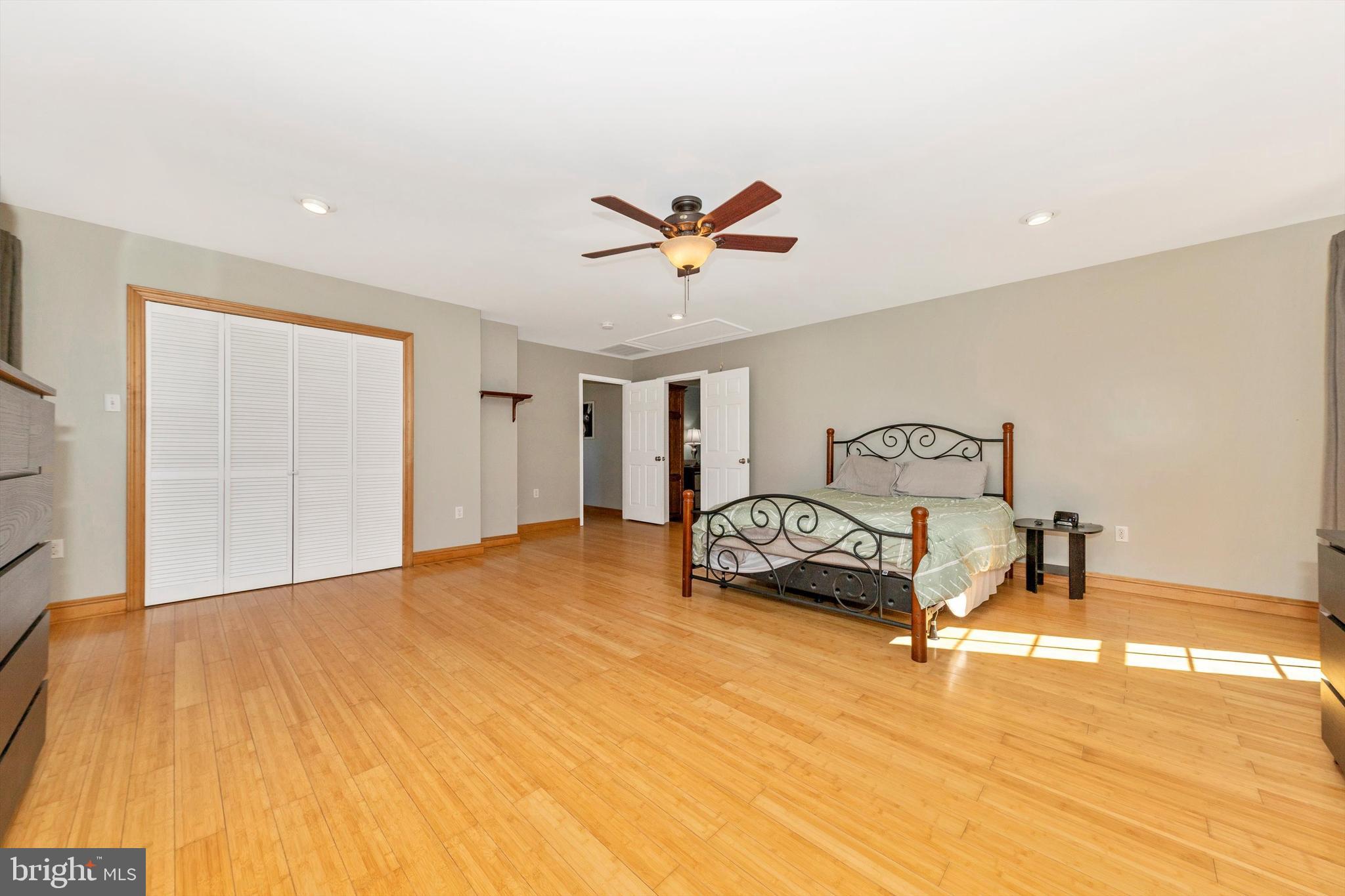 17449 Irishtown Road Emmitsburg, MD 21727 - Photo 18 of 77 a bedroom with a bed and a chandelier