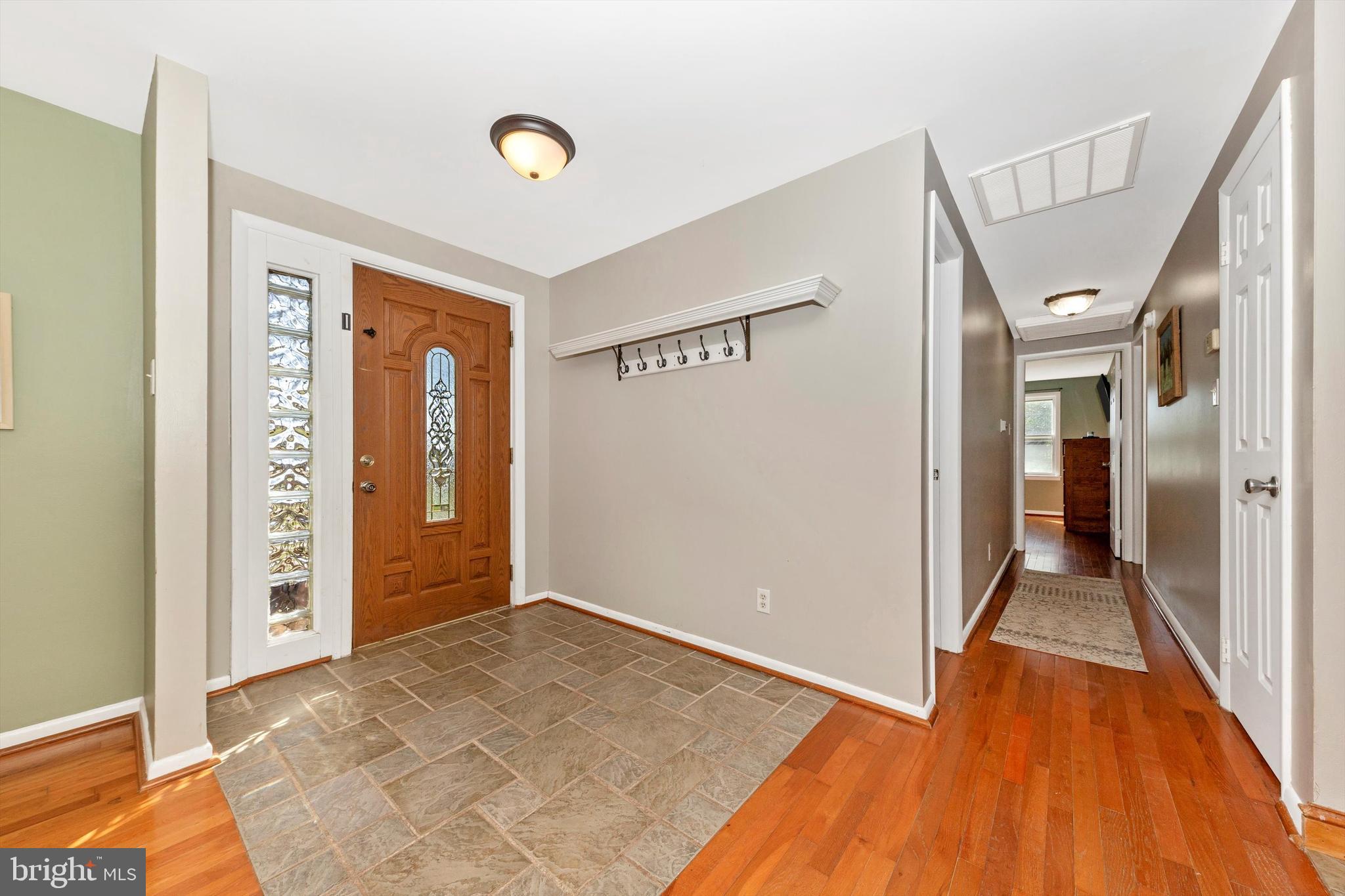 17449 Irishtown Road Emmitsburg, MD 21727 - Photo 2 of 77 a view of a hallway with wooden floor and staircase