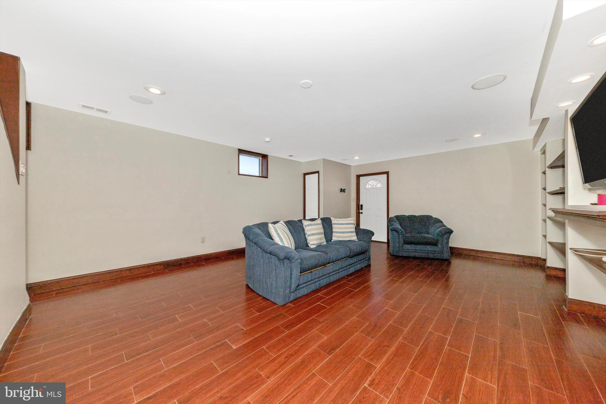 17449 Irishtown Road Emmitsburg, MD 21727 - Photo 32 of 77 a living room with furniture and a wooden floor