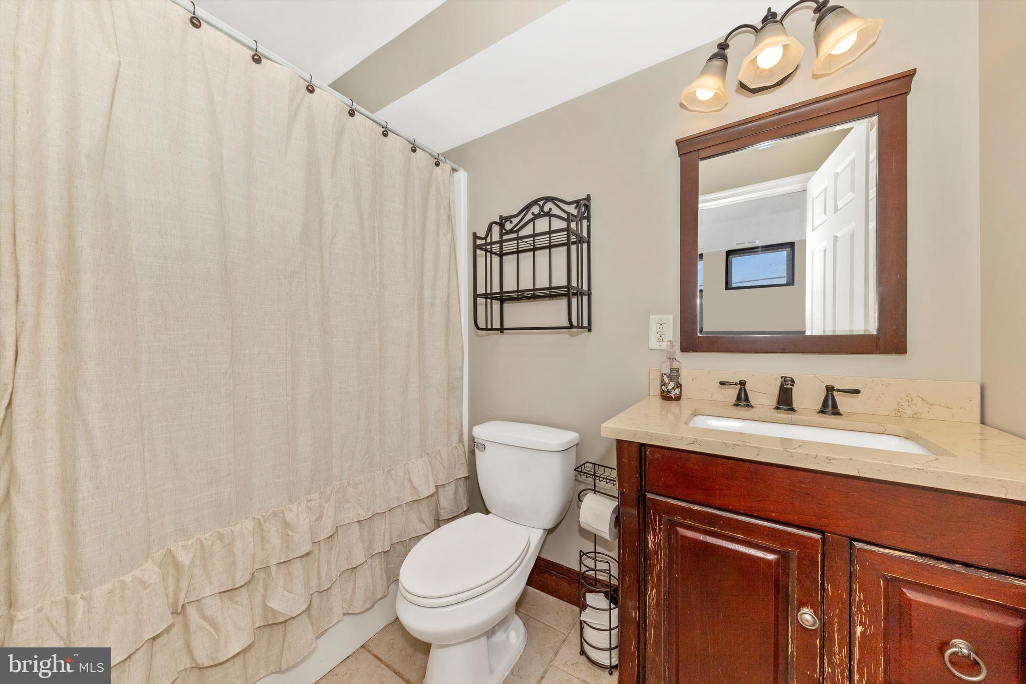 17449 Irishtown Road Emmitsburg, MD 21727 - Photo 35 of 77 a bathroom with a toilet a sink and a mirror