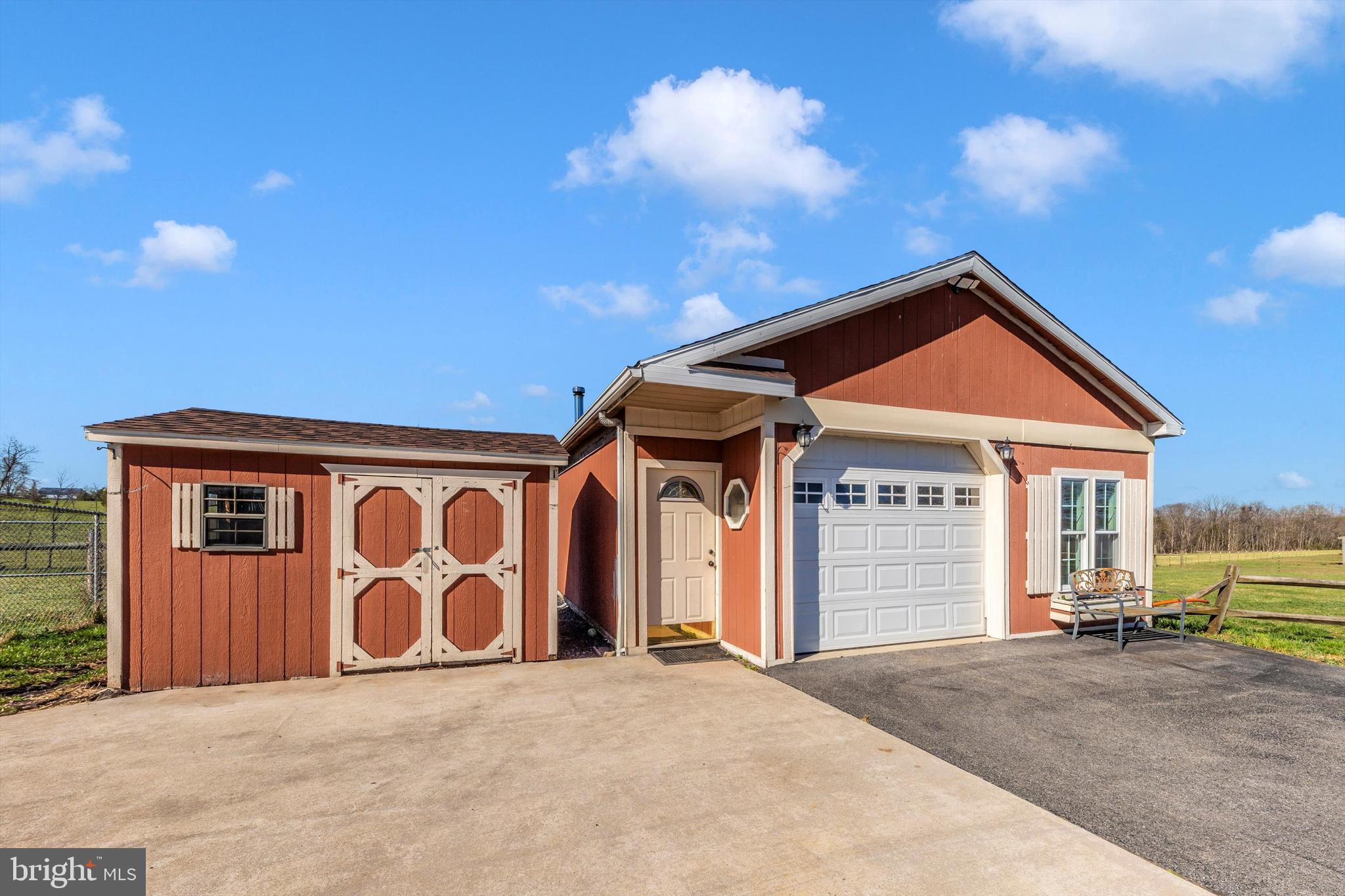 17449 Irishtown Road Emmitsburg, MD 21727 - Photo 49 of 77 a front view of a house with a garage and yard