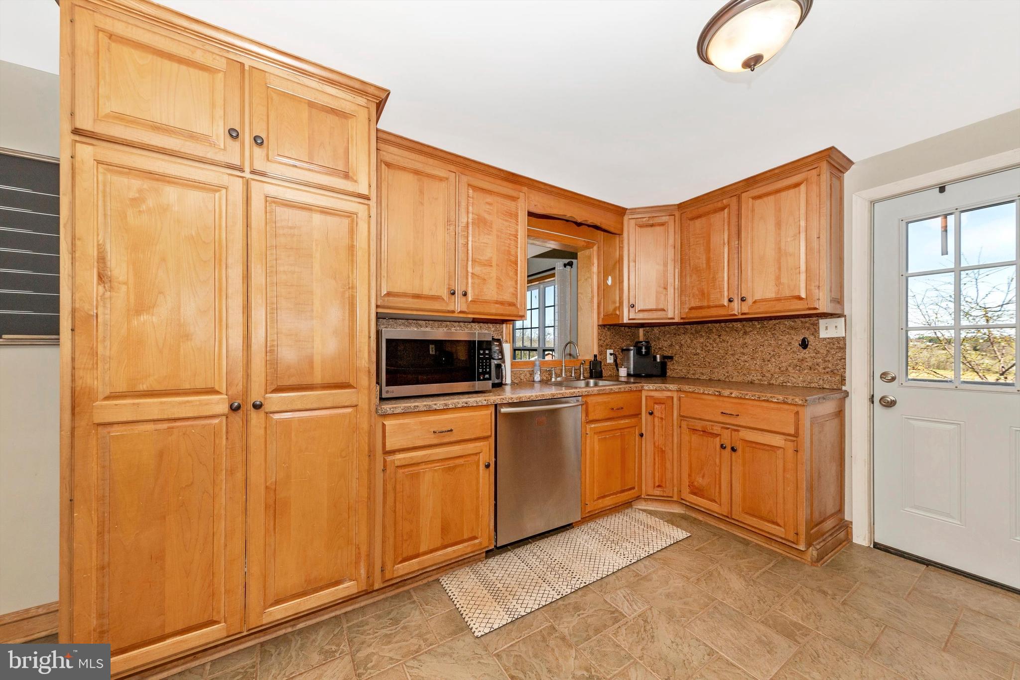 17449 Irishtown Road Emmitsburg, MD 21727 - Photo 9 of 77 a kitchen with stainless steel appliances granite countertop a refrigerator sink and cabinets