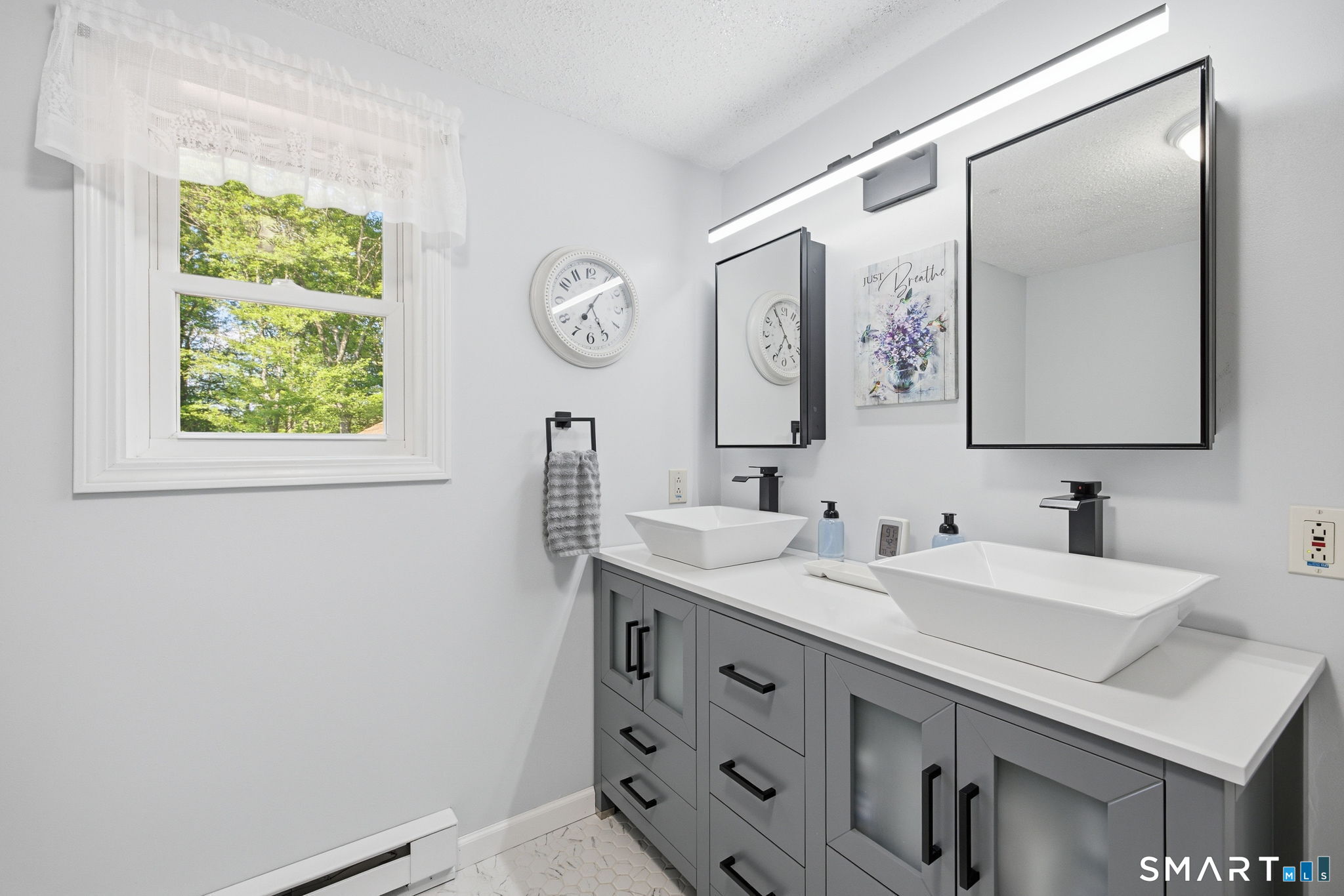 141 Hop River Road Coventry, CT 06238 - Photo 20 of 40 a bathroom with a sink and a mirror