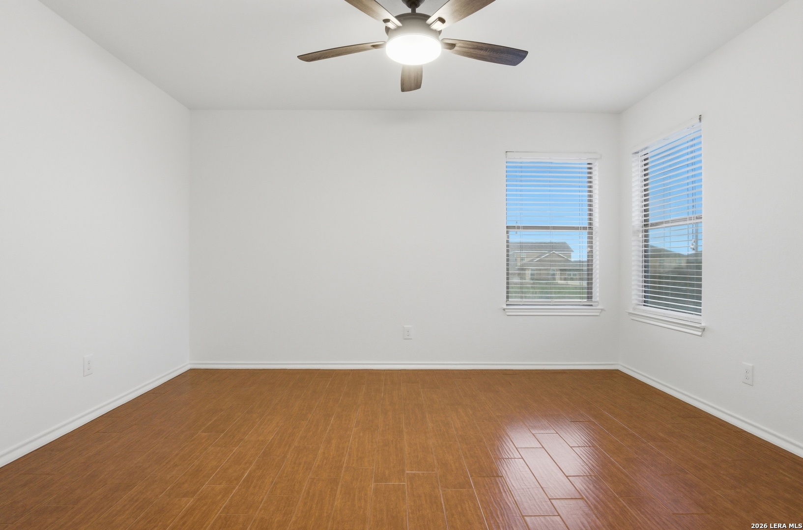 509 Brook Shadow Cibolo, TX 78108 - Photo 16 of 38 wooden floor in an empty room with a window
