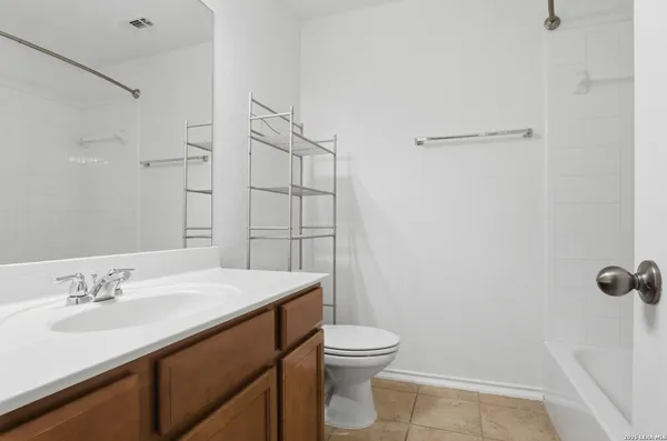 a bathroom with a sink toilet and vanity