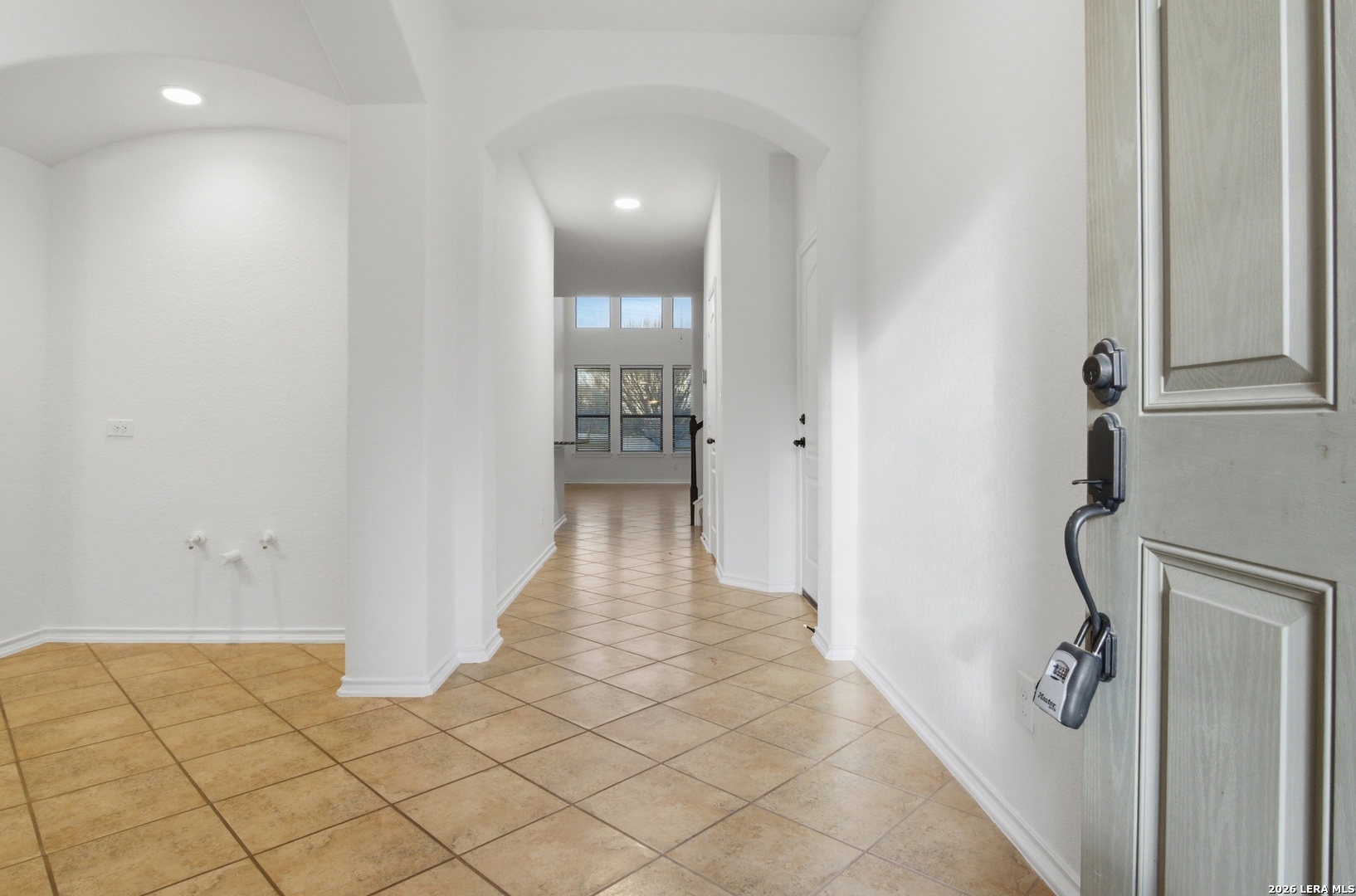 509 Brook Shadow Cibolo, TX 78108 - Photo 4 of 38 a view of a hallway with wooden floor and staircase