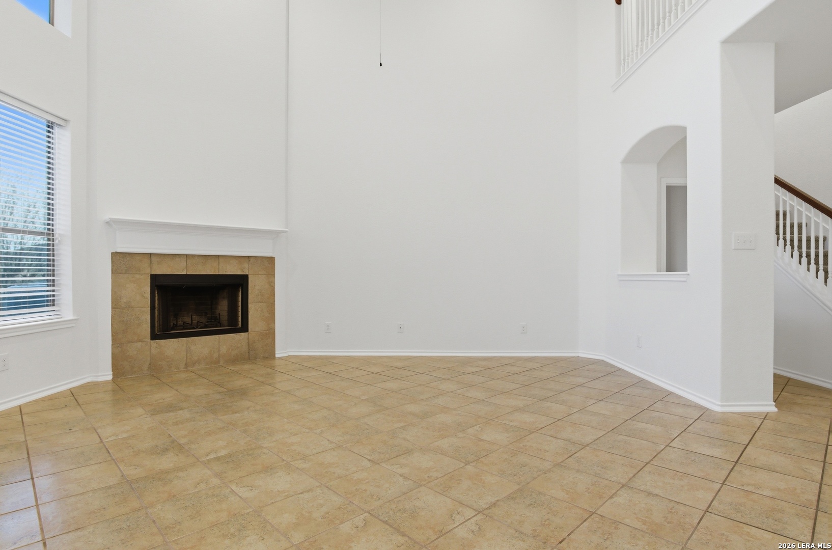 509 Brook Shadow Cibolo, TX 78108 - Photo 8 of 38 a view of an empty room with a fireplace and a window