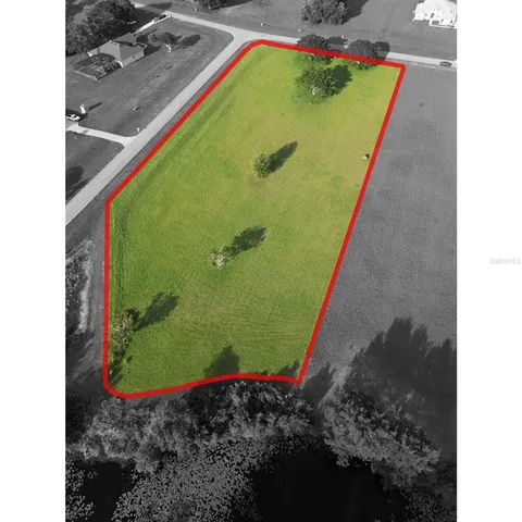 a view of a swimming pool with a yard