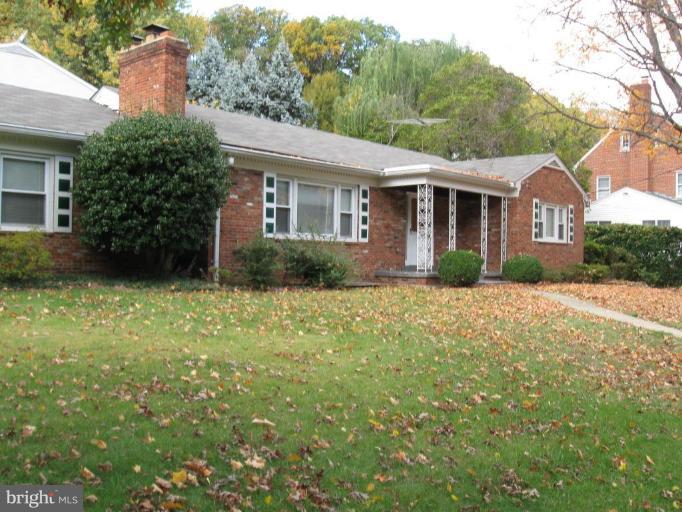 3306 Russell Road Alexandria, VA 22305 - Photo 1 of 21 a front view of a house with garden