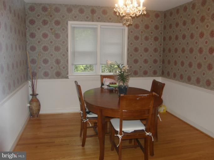 3306 Russell Road Alexandria, VA 22305 - Photo 4 of 21 a view of a dining room with furniture and chandelier