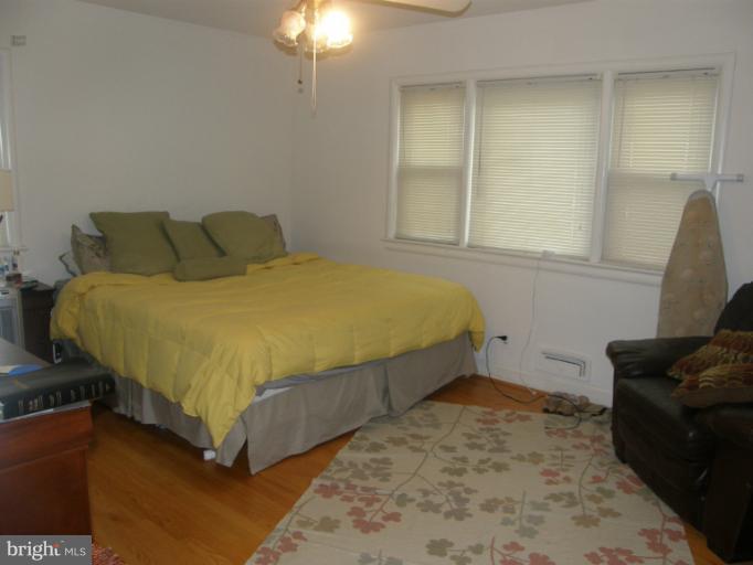 3306 Russell Road Alexandria, VA 22305 - Photo 6 of 21 a bed sitting in a bedroom next to a window