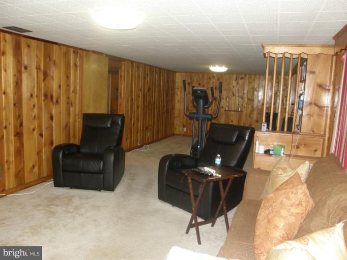 3306 Russell Road Alexandria, VA 22305 - Photo 8 of 21 a living room with furniture rug and lamp