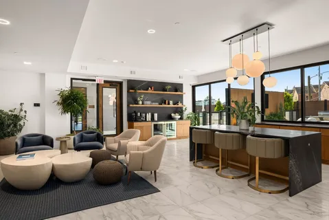 a large kitchen with a table and chairs