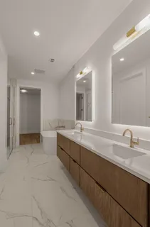 a bathroom with a bathtub and a shower