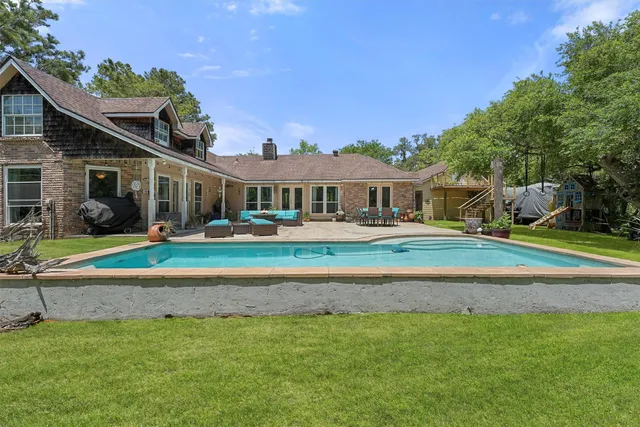 a front view of a house with a yard table and chairs