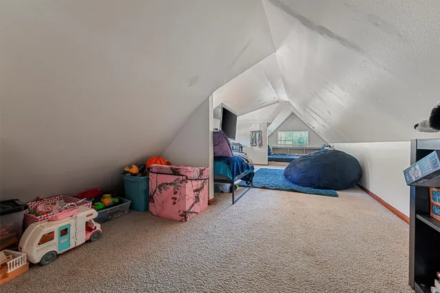 a bedroom with furniture and a chandelier