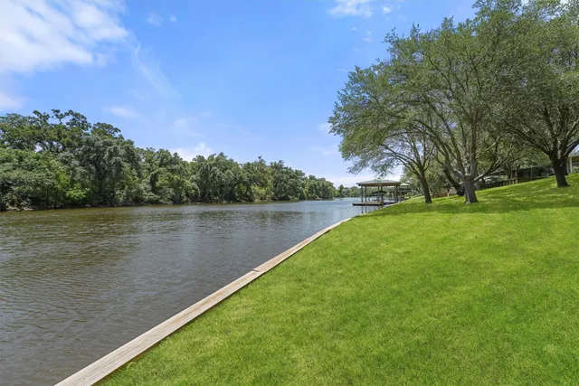 a view of a lake with a yard