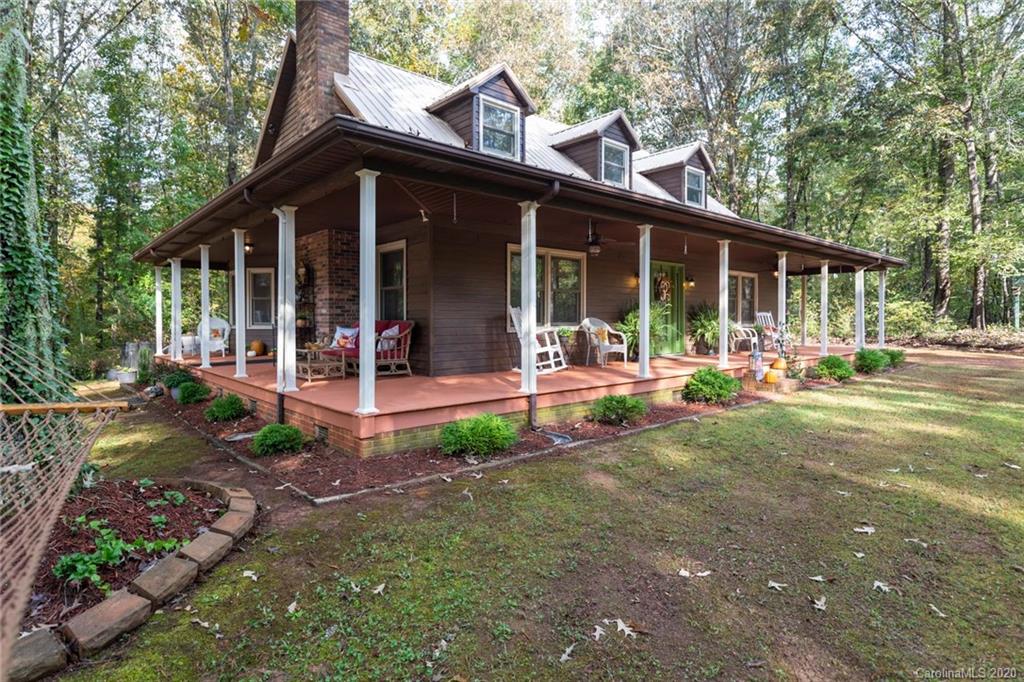 345 Whiteside Road Clover, SC 29710 - Photo 2 of 46 a front view of a house with garden