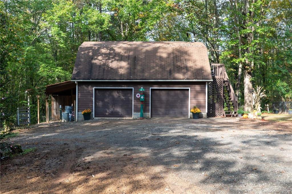 345 Whiteside Road Clover, SC 29710 - Photo 11 of 46 a front view of a house with a garden and yard