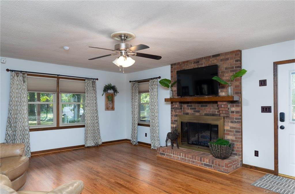 345 Whiteside Road Clover, SC 29710 - Photo 14 of 46 a living room with furniture fireplace and flat screen tv