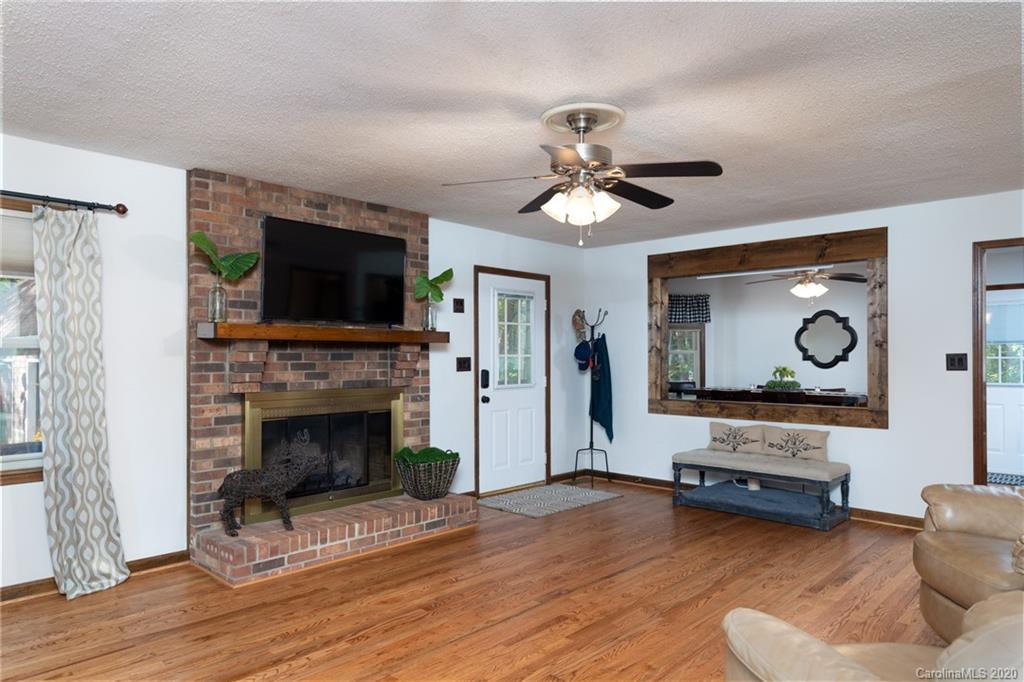 345 Whiteside Road Clover, SC 29710 - Photo 15 of 46 a living room with furniture flat screen tv and a fireplace