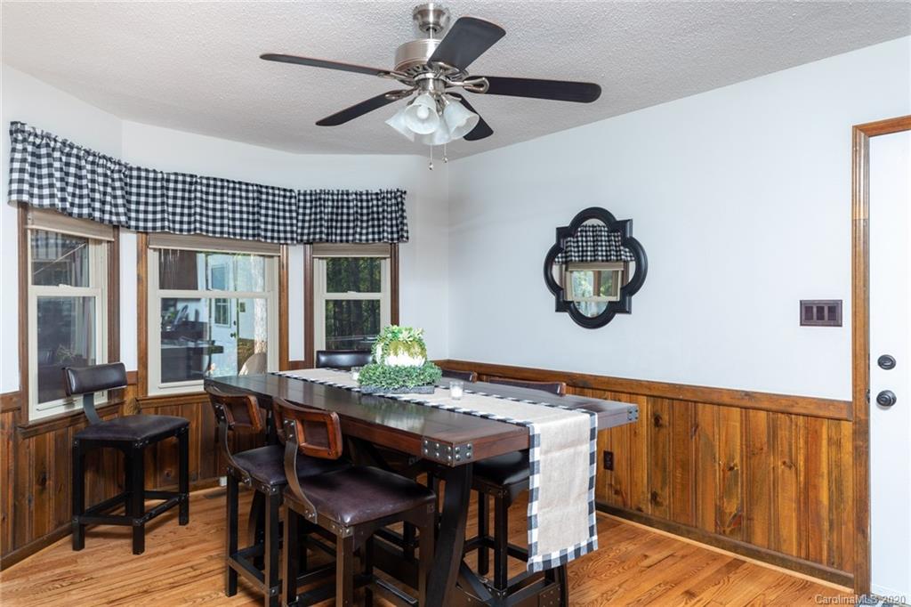 345 Whiteside Road Clover, SC 29710 - Photo 24 of 46 a view of a dining room with furniture wooden floor and chandelier