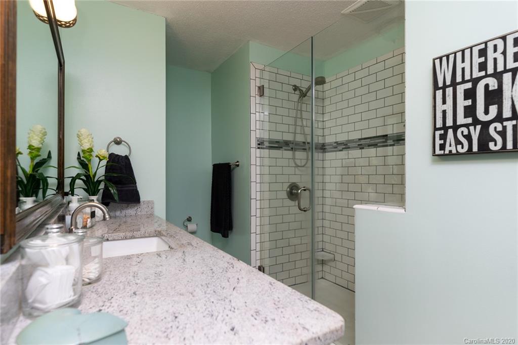 345 Whiteside Road Clover, SC 29710 - Photo 28 of 46 a bathroom with a sink and a mirror