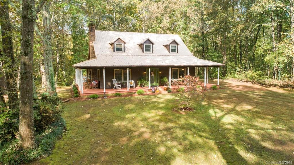 345 Whiteside Road Clover, SC 29710 - Photo 4 of 46 a front view of a house with a yard table and chairs