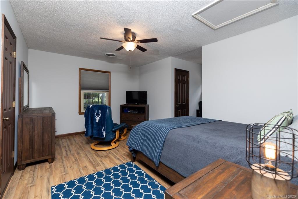 345 Whiteside Road Clover, SC 29710 - Photo 31 of 46 a bedroom with a bed a table and chair