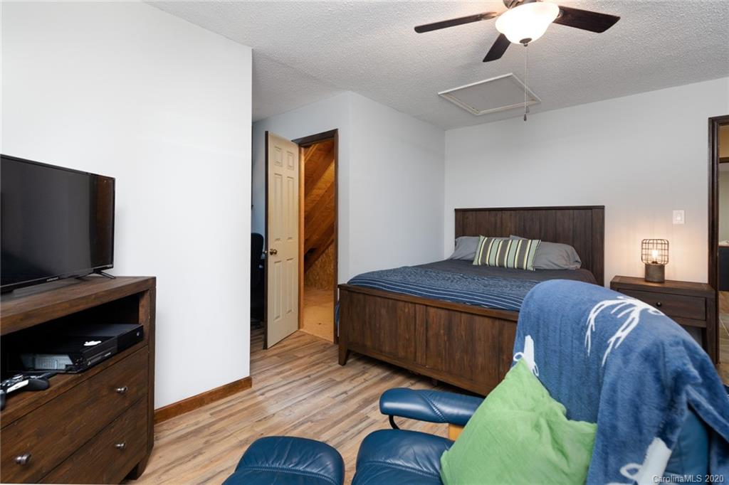 345 Whiteside Road Clover, SC 29710 - Photo 32 of 46 a bedroom with a bed and a flat screen tv