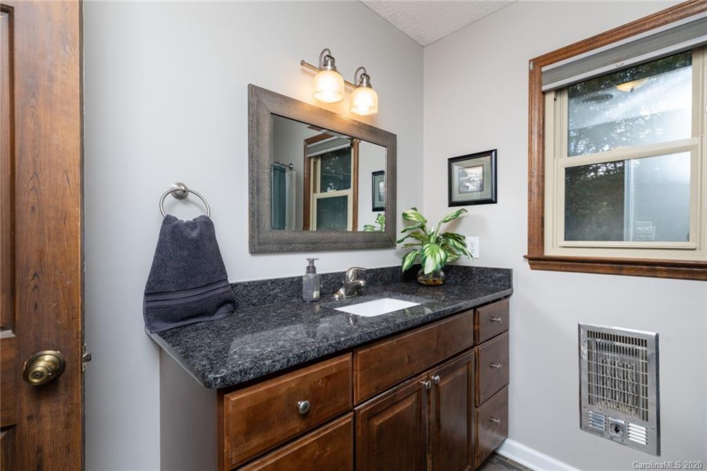 345 Whiteside Road Clover, SC 29710 - Photo 35 of 46 a bathroom with a granite countertop sink and a mirror