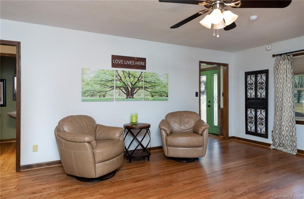 345 Whiteside Road Clover, SC 29710 - Photo 38 of 46 a living room with furniture and a wooden floor