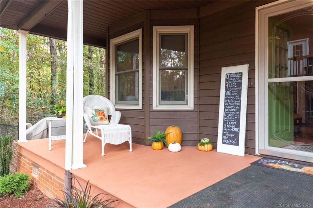345 Whiteside Road Clover, SC 29710 - Photo 8 of 46 a view of a patio with a table and chairs