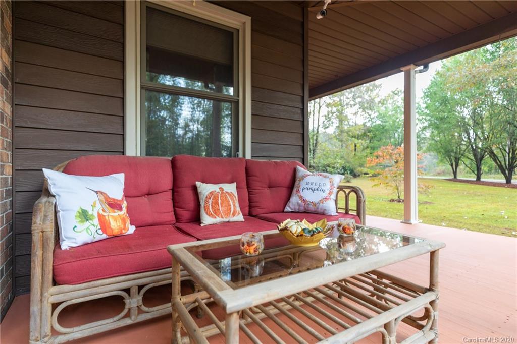 345 Whiteside Road Clover, SC 29710 - Photo 9 of 46 a outdoor sitting area with furniture and a garden